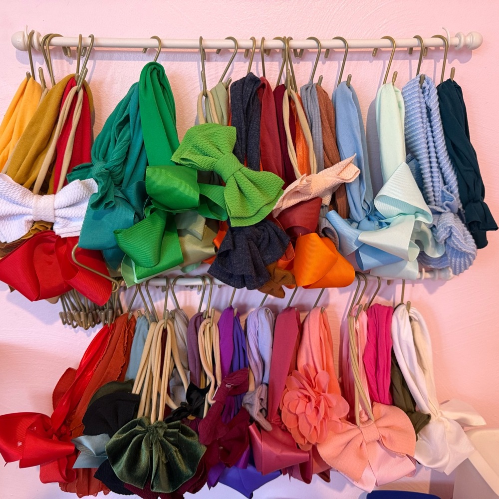 (2) bow holders with 60 solid color bows and hooks